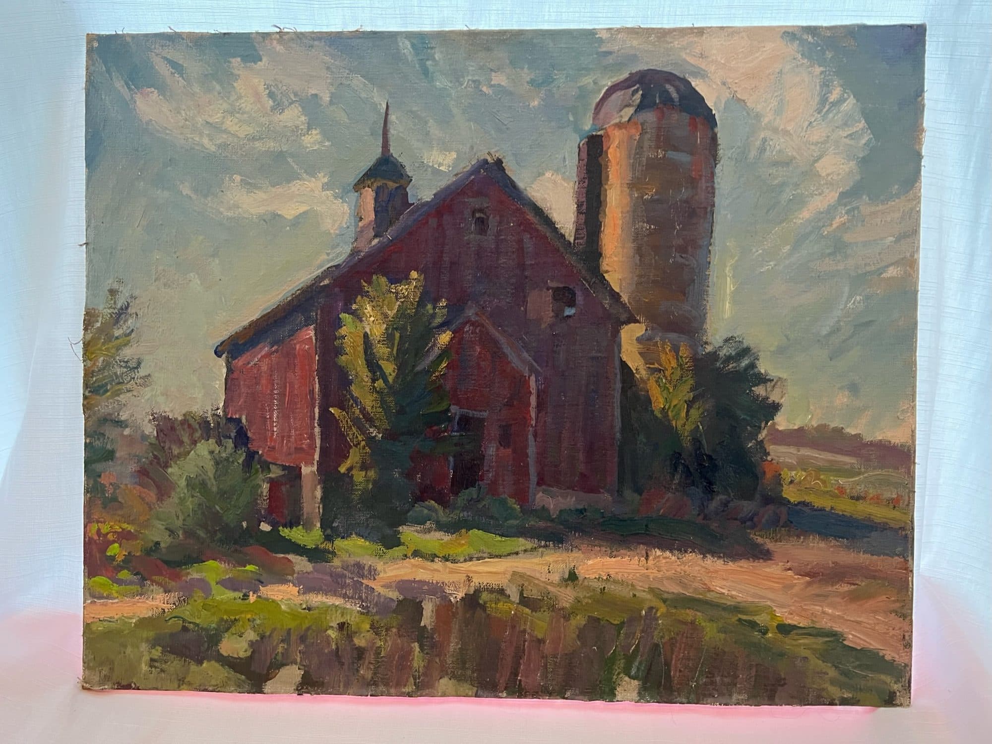Red Barn With Silo And Trees