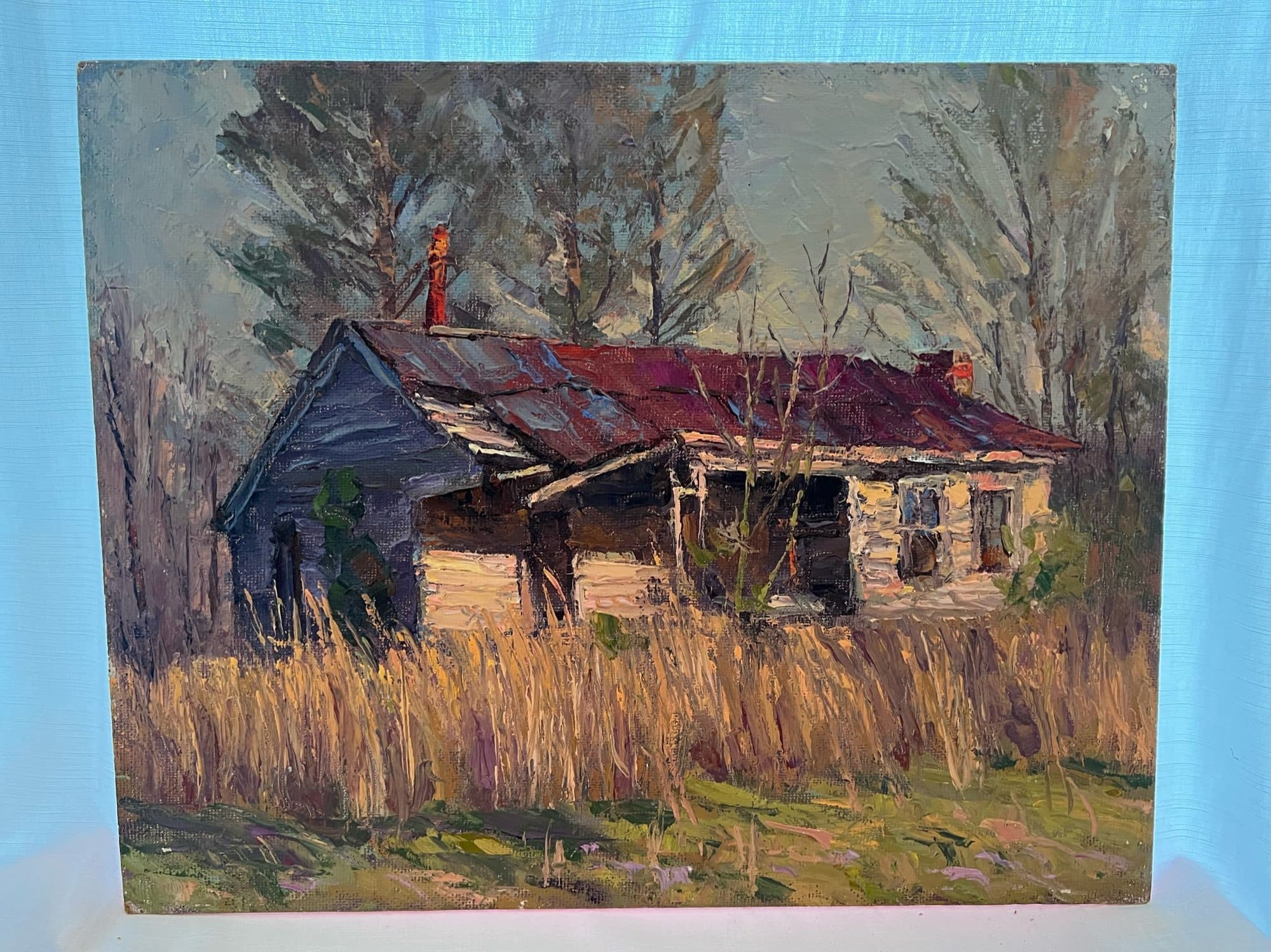 Weathered Farmhouse With Red Roof